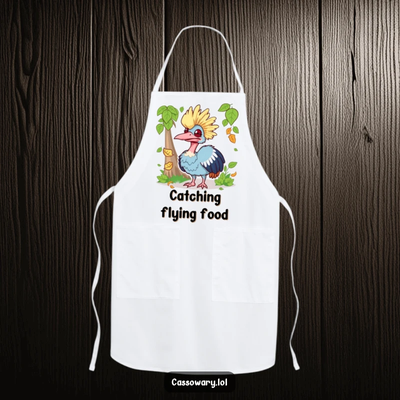 Funny apron featuring a cassowary making a silly face while trying to catch a falling leaf, ideal for kitchen fun and messy cooks.