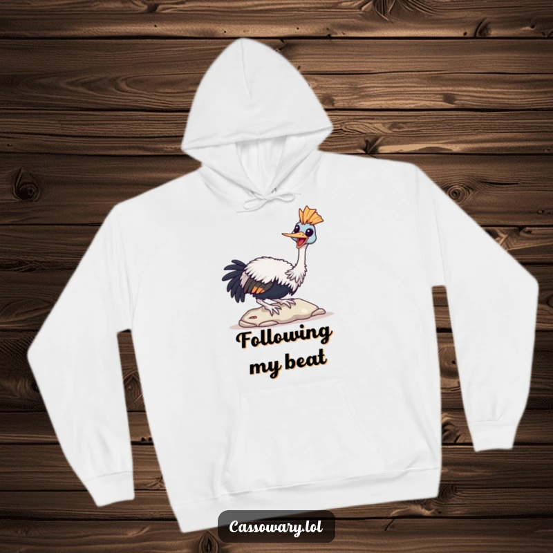 Funny Cassowary Hoodie depicting a bird joyfully tapping its beak on a stone, offering cozy cheer.