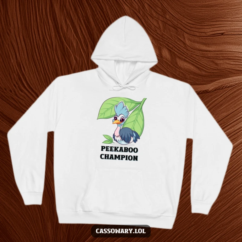 Funny cassowary hoodie showing a cheerful bird peeking from behind a large leaf, offering cozy comfort with a humorous and cute design.