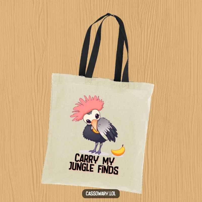 Funny tote bag with a cassowary playfully nudging a fallen mango, demonstrating a comical wildlife moment for everyday use.